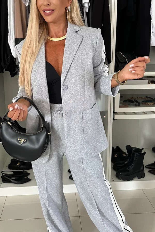 Ensemble audacieux avec blazer sportif et pantalon large à poches